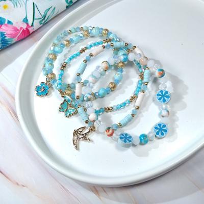 China Wholesale Lower Price CLASSIC Light Ocean Blue Beads Charm Bracelets With Butterfly Flower Charms For Women Jewelry Gift for sale