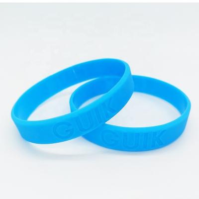 China All Personalized debossed Rubber Bracelet Custom Logo Sports Carving Promotion Concave Intaglio Silicone Wristband for sale