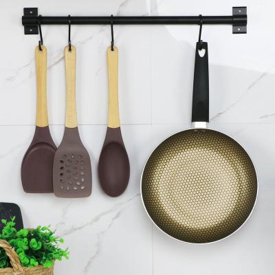 China Sustainable Pan Honeycomb Induction Heavy Duty Non Stick Frying Pan With Bakelite Handle for sale