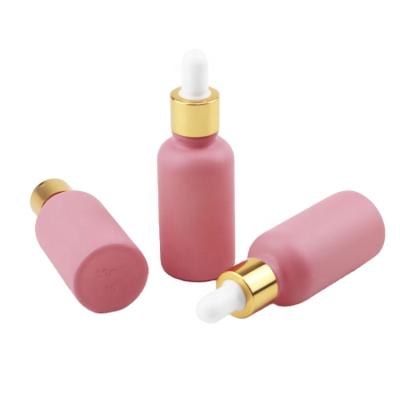 China Competitive Reasonable Cute Bamboo Rubber Collar Cap+Glass Pipette+Silicone Coated Low Price 30ml Purple Bottle Colored Frosted Matte Pink Glass Dropper Bottles With Pipette for sale