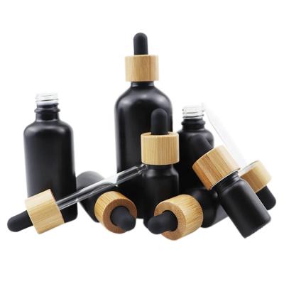 China Luxury Bamboo Rubber Necklace Packaging Cosmetics Empty Bamboo Cap+Glass Pipette+Silicone Bamboo 10ml Round Black Bottles 10ml Essential Oil Glass Dropper Bottle For Essential Oils for sale