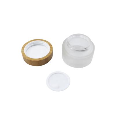 China Eco-friendly Bamboo Cap With 50 gm 50g Luxury Empty White Frosted Glass Cosmetic Cream Container Liner Jar 50ml Packaging Jars With Yellow Bamboo Lids Top Cap for sale