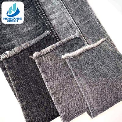 China 9.0oz OE Twill Black 68% Cotton Printed Jeans Tear-Resistant Stretch Denim Fabric for sale