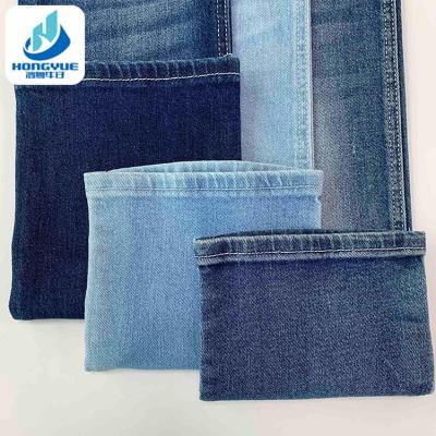 China Blue Tear-Resistant 8.1oz Blue Denim Fabric Stretch Cotton Twill Raw Denim Fabric for sale