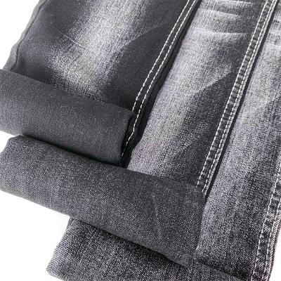 China Wrinkle Resistant 10oz Black Denim Fabric Super Stretch Woven Jeans Fabric With Roving for sale