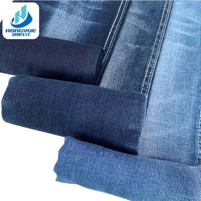 China 10oz Blue Denim Fabrics Textile Tear-Resistant Jeans Fashion Cotton Denim Fabric 2022 Yarn for sale