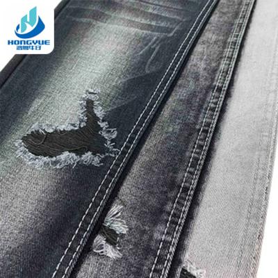 China Wrinkle resistant cotton woven 12.1oz denim fabric jeans material black wholesale denim fabric for dress jeans for sale