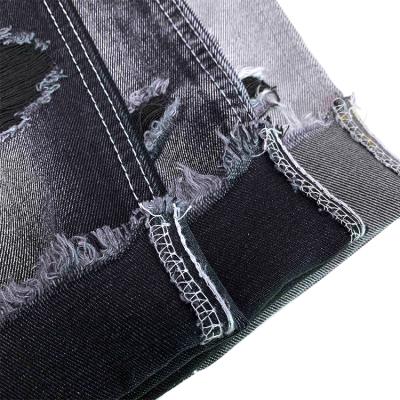 China Wrinkle Resistant Black 12.4oz Jean Material Cotton Hard Jeans Fabric for sale