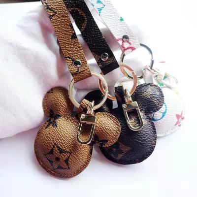 China New Design 3 Colors Cute Car Piece Leather Bowknot Mouse Luxury Genuine Leather Key Chain for sale