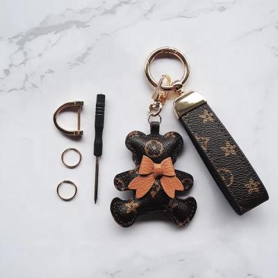 China FASHIONABLE 5 Colors Bow Cute Animal Leather Bear Hot Selling Personalized Key Chain Jewelry for sale