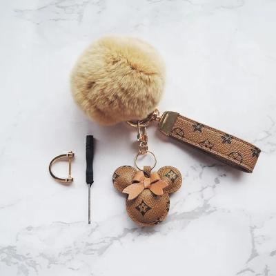 China 2021 leather fashion lovely cute animal leather mickey tassel fur ball purse key chain for sale