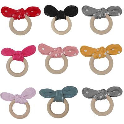 China Wooden Ring Baby Teething Pacifier Teether Amazone Grade Baby Food BPA Safe Bracelet Wholesale Free Molars for sale