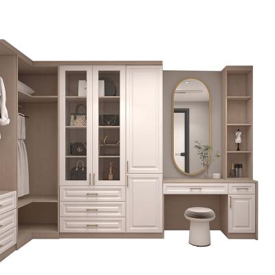 China Modern Bespoke Elegant Wardrobe Corner Bedroom Swing Resistant Wardrobe With Dressing Tables for sale