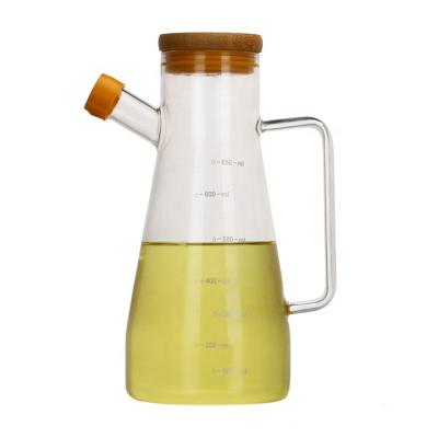 China Eco - Friendly Kitchen Olive Oil Glass Cooking Bottle Sustainable With Bamboo Lid And Handle for sale