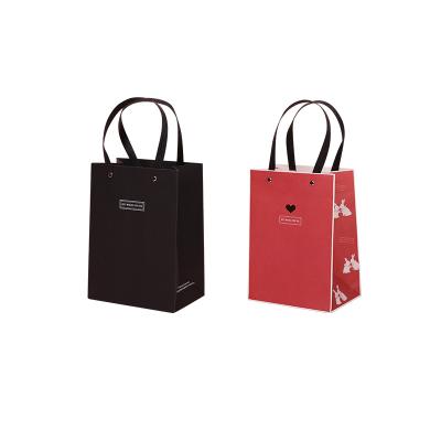 China Recyclable Wholesale Premium Gift Food Custom Paper Clothing Packaging Bag for sale