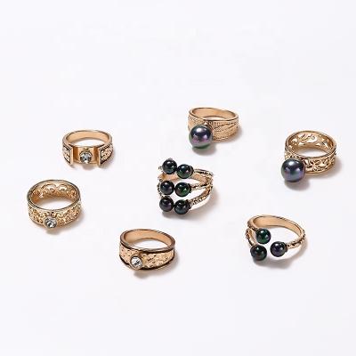 China TRENDY 7pcs Women's Fashion Punk Exaggerated Personality Set Shine Color Pearl Ring Set for sale