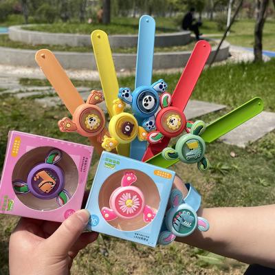 China Promotional Gifts/Party Mosquito Repellent Cartoon Cat Dinosaur Panda Rotating Light Toys Beat Wristbands Children's Baby's Toy Watch for sale