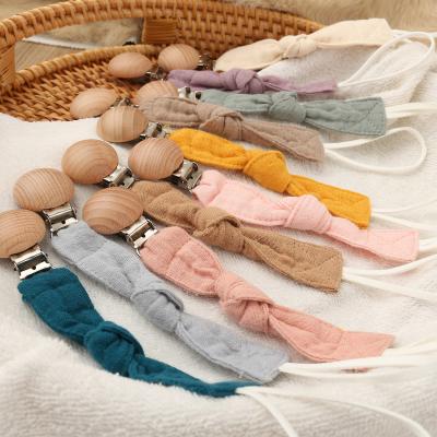 China Toy Infant Teething Toy Soft Silicone Pacifier Chain Clips, Wooden Bead Round Pacifier Clip for sale