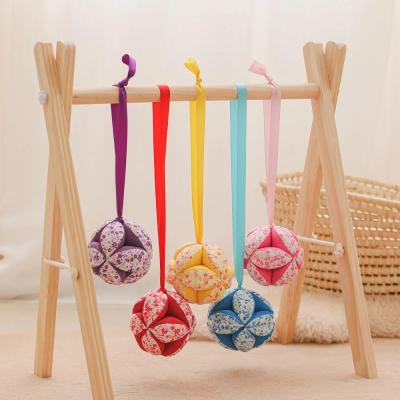 China Soft Toy Baby Rattle Toy Hand Catching Ball Toy Colorful Rattle Ball Toy With Ribbon Soothe Bed Hanging for sale