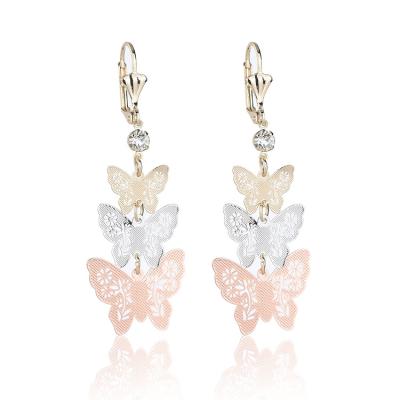 China Hollow Butterfly Flower Earrings Non-allergic Three-color Long Earrings for sale