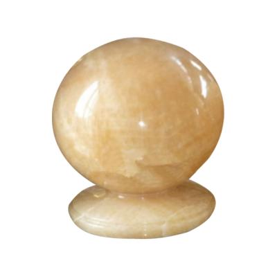 China Traditional Wonderful Yellow Onyx Ball Stone Garden Small Marble Products for sale