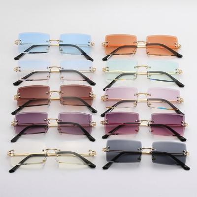 China 2021 Fashion Sunglasses Style The New Square Small Rectangle Sunglasses Rimless Sun Glasses Shading Hot Sales for sale