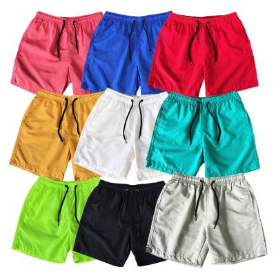 China Casual Anti-wrinkle Beach Candy Color, Summer Men's Running Fitness Shorts Polyester Nylon Shorts for sale