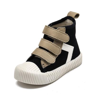 China Latest Design Kids Soft Bottom Canvas Shoes Flat Korean High Top Biscuit Shoes for sale