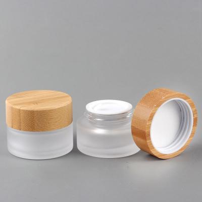 China Eco-friendly Cosmetic Packaging 15g 20g 30g 50g 100g White 15ml 20ml 30ml 50ml 100ml 15 gram 20g Clear Frosted Glass Jar With Bamboo Lid for sale