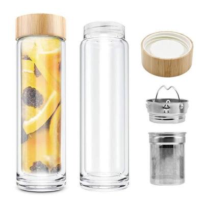 China Sustainable Bamboo lid tea infuser fruit juice leak-proof custom logo borosilicate glass water bottle for sale