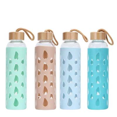 China Sustainable Bamboo lid with rope sleeve leak-proof glass water bottle wholesale for sale