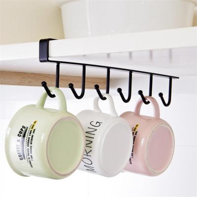 China Multi-Function Iron Row Storage Rack Cabinet Hangs Seamless Wardrobe Rack Kitchen Nail-Free Hook for sale