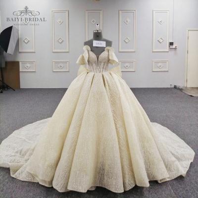 China Anti-Static Luxury Elegant Shiny Ball Gown Bridal Wedding Dress With Detachable Bowknot for sale