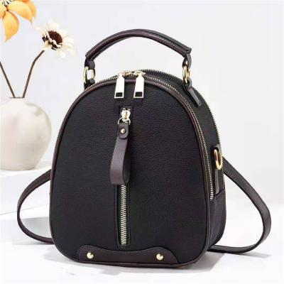 China Stylish Chic Waterproof Shell Shape Headphone Lychee Pattern Plug Mini Women PU Leather Leather Backpack Handbag for sale