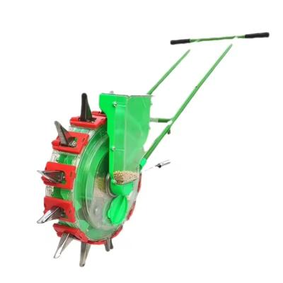 China Farms Potato Planter Pot /Corn And Soybean Seed Push Planter /Vegetable Seed Machine Machine Mini Seeder The New Hand-push Type for sale