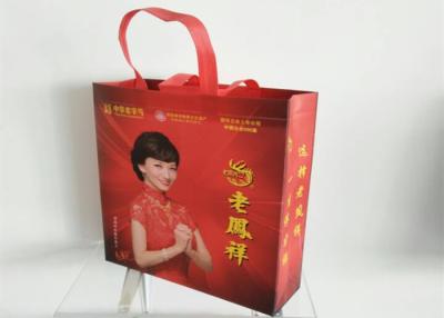 China Qingdao Water Proof Gold Advertisement Non Woven Gift Bags Shopping Bags for sale