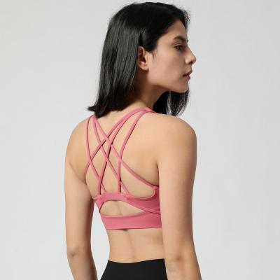 China 2021 New Arrivals Breathable Sexy Cross Back Yoga Sports Bra Fitness Wear Women Sports Gym Tops Female OEM for sale