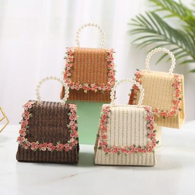 China Clutch Evening Clutch Bag 2021 New Summer Fashion Straw Woven Bag Portable Diagonal Cute Children Bead Kids Clutch Bag for sale