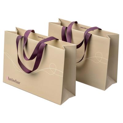 China New Arrival Recyclable Custom Printed Hot Stamping Logo Luxury Gold Jewelry Gift Paper Bag With Ribbon Handle for sale