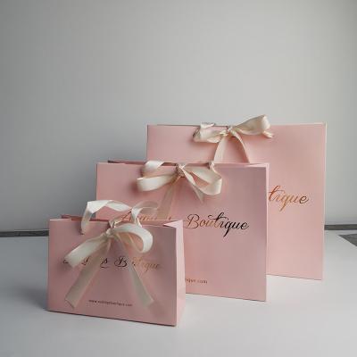 China Wholesale Custom Logo Recyclable Rose Gold Foil Stamping Luxury Boutique Jewelry Paper Bags With Ribbon Handle for sale