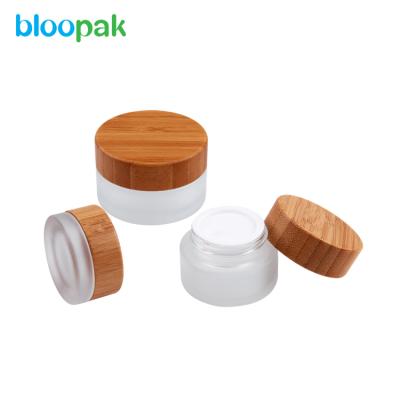 China Wholesale Cosmetic Glass Jar Bamboo Lid 50ml Bamboo Cream Jar for sale