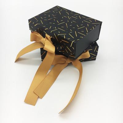 China Good Quality EVA Insert Small Size Custom Gift Packaging Foldable Magnetic Black Luxury Gift Box With Ribbon Closure Gold Hot Stamping for sale