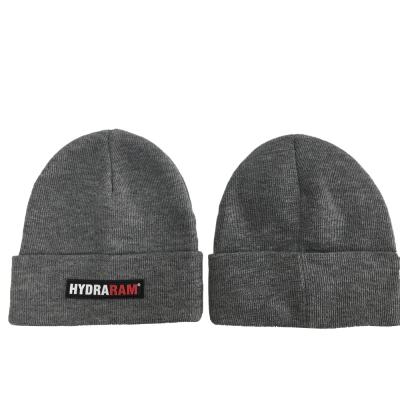 China COMMON custom badge men /women beanies hat rubber patch jacquard knit winter cap hats for sale