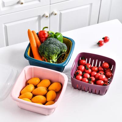 China Kitchen Double Round Fruit Basket Creative Viable Sink Functional Plastic Fruits And Vegetables Receiving Basket for sale