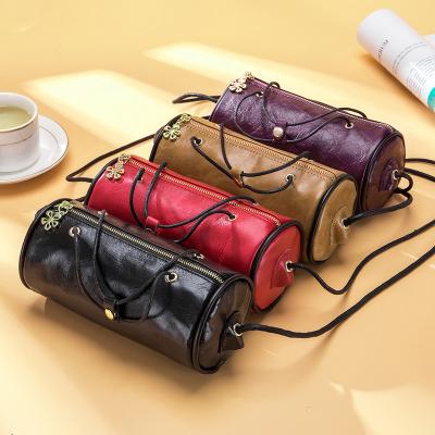 China Fashion lady's real cross small leather round shoulder bag - body clutch handbag for sale