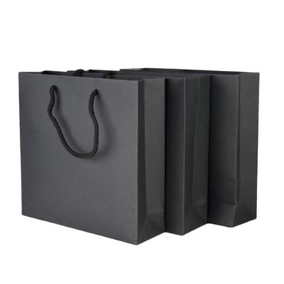 China Recyclable Wholesale Black 250gsm Paper Shopping Bag Gift Gift Bags Black Packaging With Rope Handles for sale