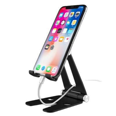 China New PORTABLE Hot Selling Adjustable Cell Phone Stand Folding Stand Mobile Phone Laptop Desktop Stand for sale