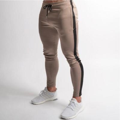 China Breathable Custom Stretched Workout Sweatpants Men Jogger Pants Big Pockets Casual Gym Fleece Skinny Fitness Panties for sale