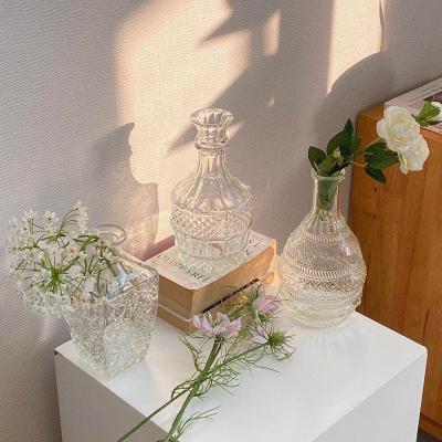 China Wholesale Reusable Nordic Style Clear Factory Cylinder Relief Glass Vases For Home Decor for sale