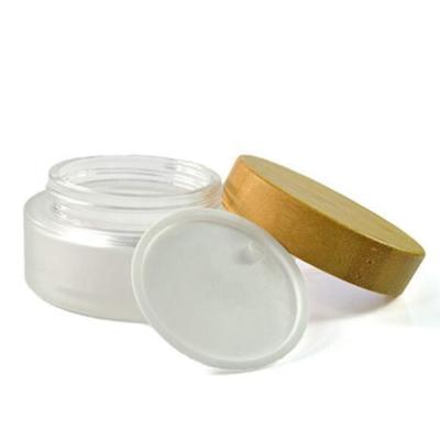 China 50g cosmetic frosted transparent glass cream jars with bamboo caps for sale